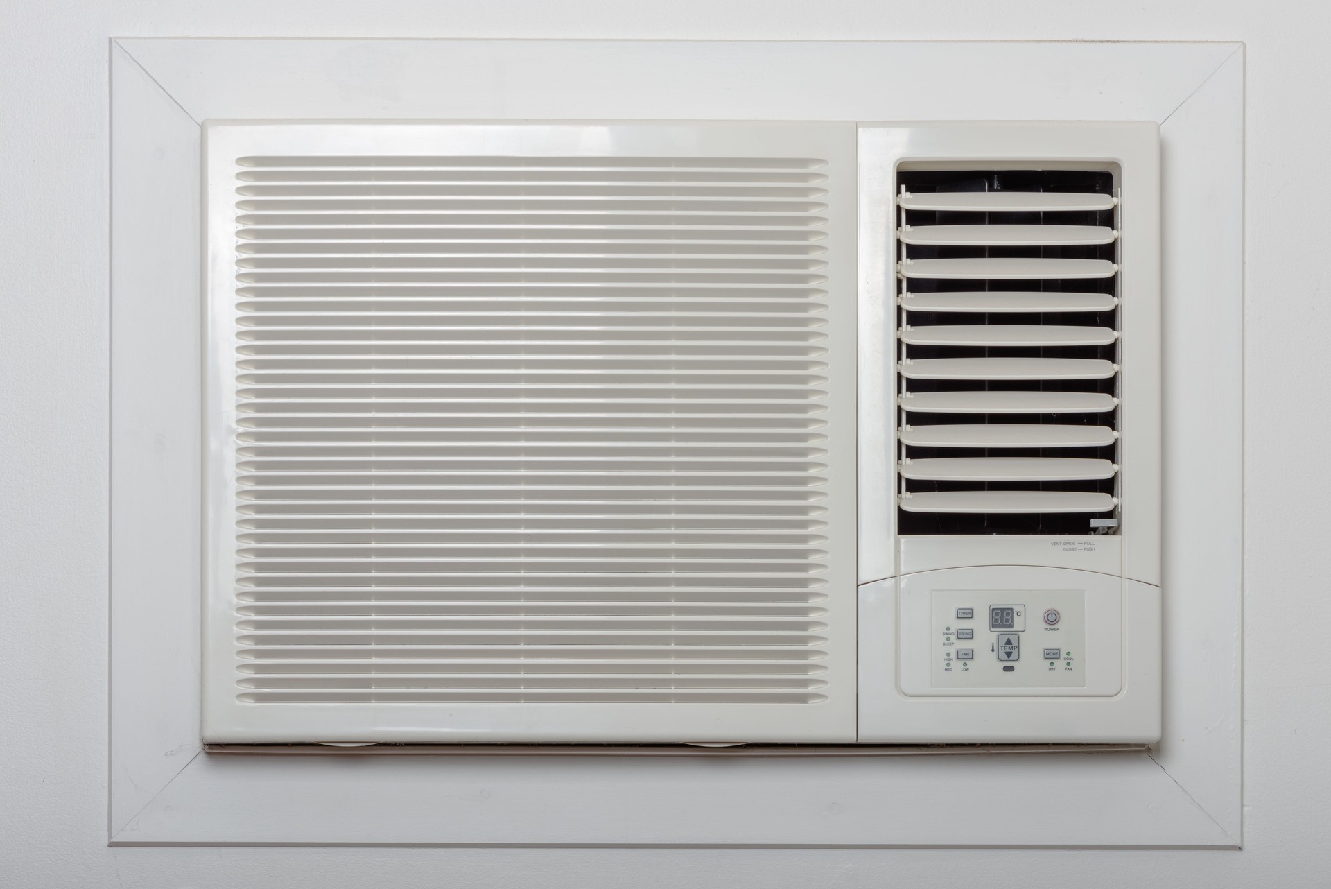 And old styled air conditioner on the wall.